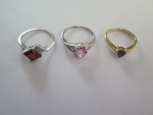 Two 9ct white gold rings, a yellow gold 9ct ring sizes N and R - total weight approx 6.7 grams - all