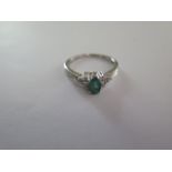 An 18ct white gold emerald and diamond ring size O/P - approx weight 3 grams - with certificate,