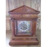 A Junghans 8 day bracket clock in a walnut case, quarter chimes on two gongs - running - Height 43cm