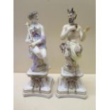 A pair of porcelain figures of Pan and companion with blue crown of Naples type mark - Height 22cm -