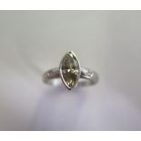 A handmade platinum diamond ring with a central Marquise cut light champagne diamond - approx 0.94ct