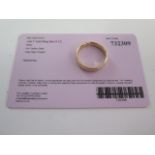 A 14ct yellow gold band ring size P - approx weight 1.6 grams - with certificate - good condition