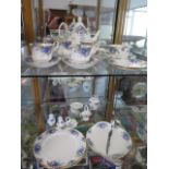 A Royal Albert Moonlight Rose blue printed tea set - four piece with two dinner plates, cake