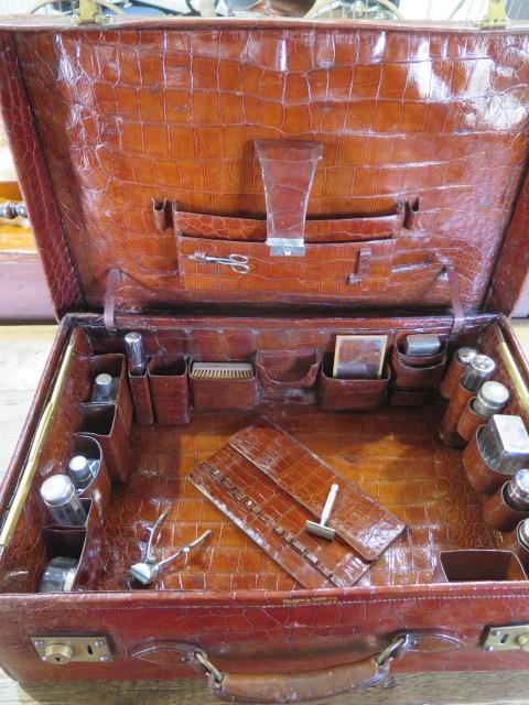 An Edwardian crocodile leather gentleman's vanity case , trunk, by Mappin and Webb , the hinged