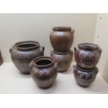 A set of 6 19th century salt glaze earthenware storage jars ranging from 20cm to 12cm tall - all