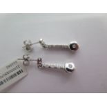 A pair of white gold drop diamond earrings - 0.10pt each earring - 2cm long - approx weight 2