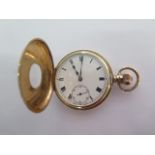 A 9ct yellow gold top wind half hunter pocket watch - 50mm case - approx weight 97 grams - generally