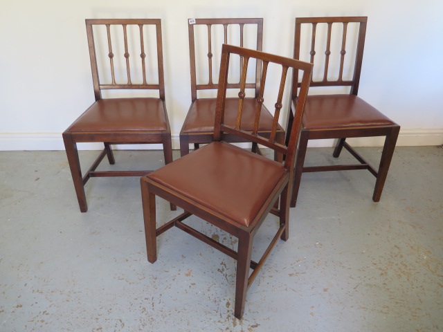 A set of four mahogany dining chairs with drop in leather seats