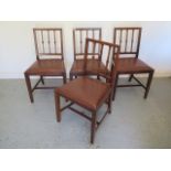 A set of four mahogany dining chairs with drop in leather seats