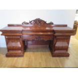 An impressive early 19th century mahogany twin pedestal sideboard with two cupboards and three