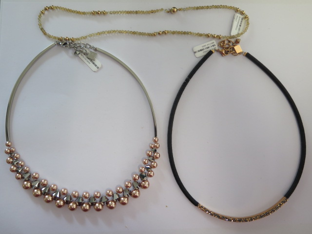A Coeur de Lion rose gold beaded necklace, a Coeur de Lion rose gold/black cord necklace and a 9ct