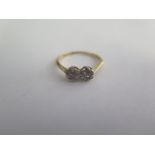 An 18ct diamond double flower ring size L/M - approx weight 1.8 grams - good condition