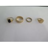 Four 9ct yellow gold rings sizes J to U - total weight approx 12.4 grams