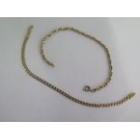 Two 9ct yellow gold bracelets 21cm long - one with replacement clasp - total weight approx 10 grams