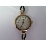 A 9ct yellow gold Rolex manual wind ladies wristwatch on a leather strap - 24mm case - not running -
