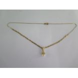 An 18ct yellow gold pearl pendant on a 42cm 18ct chain - approx weight 6 grams - generally good