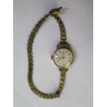 A 9ct manual wind ladies wristwatch on a plated strap - running - approx weight 14.8 grams
