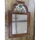 An antique walnut mirror with a reverse painted glass inset top panel - Height 78cm x Width 49cm -