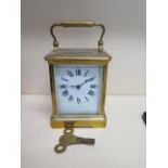 A brass carriage clock the dial signed Ross & Son - working with key