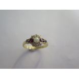 A very pretty 18ct yellow gold diamond, garnet and pearl ring size Q - approx weight 3 grams -