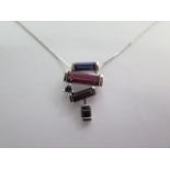 A 9ct white gold Iolite and Rhodolite pendant - matching previous lot - approx weight 4 grams -