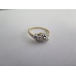 An 18ct gold diamond crossover ring size M - diamonds bright - approx weight 2.8 grams