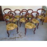 A good quality set of 10 Victorian Cuban mahogany balloon back dining chairs including two scroll