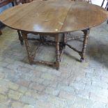 A good quality oak gateleg table raised on turned legs - Width 150cm x Length 180cm