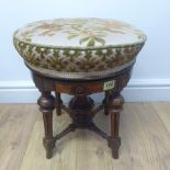A Victorian walnut revolving piano stool in polished condition, revolves easily