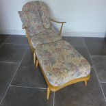 An Ercol Golden Dawn elm chair/day bed with separate stool - Height 86cm x Length 153cm - some