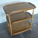 An Ercol Golden Dawn elm three tier tea trolley - Height 75cm x 70cm x 46cm - good condition,