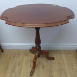 A mahogany side table with a shaped top on a tripod base, polished condition, 72cm tall x 59cm x