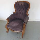 A Victorian mahogany button back upholstered armchair, 108cm tall x 70cm wide