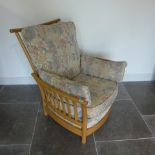 An Ercol Golden Dawn upholstered elm slatted armchair in good condition - Height 96cm x Width 84cm