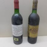 A bottle of Chateau Cissac 1985 - level below neck - and a bottle of Chateau au Batailley Grand