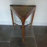 A 19th century pine triangular/cricket type table with turned stretchers and legs - Height 69cm x