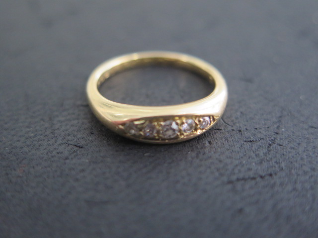 An 18ct yellow gold 5 stone diamond ring, size L, approx 4.7 grams, good condition