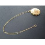 A 9ct yellow gold locket, 2.8 cm tall on a 45cm 9ct chain, total approx 4.3 grams, good condition