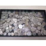 A collection of British mainly pre 1947 half silver coins mainly shillings and two shillings -