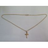 A 14ct yellow gold crucifix on a 9ct 46cm chain, total weight approx 3.5 grams