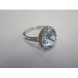 An 18ct white gold aquamarine and diamond ring, aquamarine is approx 4.50ct, head size approx 15mm x