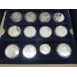 A collection of 42 silver proof ships and Explorers MDM coins, approx 1200 grams, most with