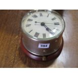 A G.P.O wall clock on a wooden boss, case 13cm diameter, 11cm tall, marked G.P.O C G 26 235 No1,