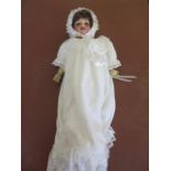 An Armand Marseille girl doll 390 with composite body, sleepy eyes and open mouth, 62cm tall