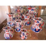 A set of 7 Masons ironstone jugs graduating in size from 24, 22, 20, 16x2, 13, 11 to 9cm, one has