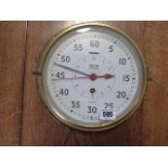 A Smiths Astral brass bulkhead clock, 25cm diameter, 10cm tall, running, good condition