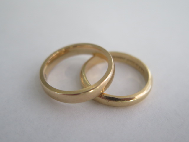 A 9ct yellow gold band ring, size L/M, approx 4 grams, and a 14ct band ring, size M/N, approx 3.3