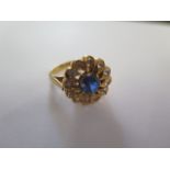 A gilt metal cluster ring, size N, approx 8.8 grams, surface tests to approx 18ct, good condition