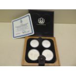 A Canadian boxed silver four coin Olympic set 1976 - approx weight 4.3 troy oz