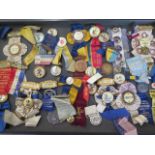 A collection of American typographical union badges and ribbons dating from the early 1900s,